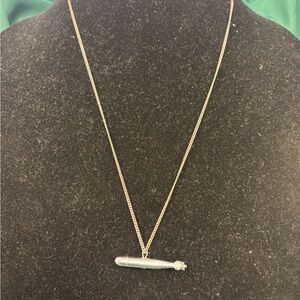 24” sterling Silver necklace with silver torpedo pendant.